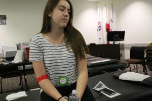 Delaney Lipp relaxes and restores her energy after donating blood for the first time.  Photo by Ashleigh Coulter - Staff Photographer 