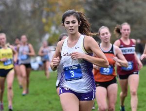 Breaking the finish line: Freshman Erin MacNeil finished first for the Regals with a time of 25:48.5. Photo Courtesy of Sandra Dubois