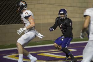 Making plays: Logan Sanders defends against an Occidental player as they turn to score at Saturday’s game. Photo Credit--Ashleigh Coulter Staff Photographer