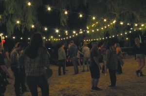 Friday night lights: Students gather to cheer on singer Amber Rose and her band for an encore song as they wave their hands in the air. Photos by Kaelani Medina- Staff Photographer 