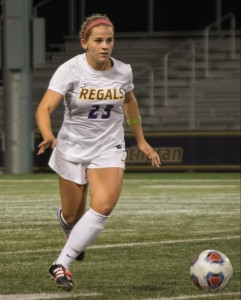 Breaking away: Senior defender Julia Kearns moves forward with the ball to position her team for a goal. Photo Credit--Ashleigh Coulter Staff Photographer