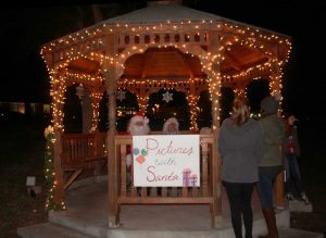 Shining lights: Cal Lutheran students get their picture taken with Santa and Mrs. Claus.