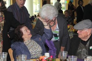 Celebrating Life and Liberation: (L to R) Clara Knopfler and Joan Wine. Knopfler and Wine share a close conversation. Photo by Morgan Mantilla- Staff Photographer 