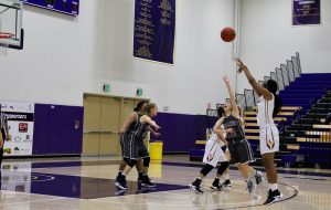 Senior Janelle Porter puts up a three to help extend the Regals score in their victory against Redlands Jan. 23. Adrian Francis--Staff Photographer