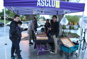 Let your voices be heard: ASCLU President Daniel Lacey (left) and ASCLU Controller Kenneth Wang (right) serve pizza and Sprinkles cupcakes in front of Ullman Commons to students who voted in person.