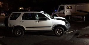 White Honda CR-V belonging to Cal Lutheran student Alex Egertson is pulled off the curb and onto a flat-bed tow truck.