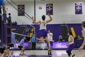 Flying past: Nick Oertli (5) getting ready to kill a solid set.  Photos by Adrian Francis--Staff Photographer