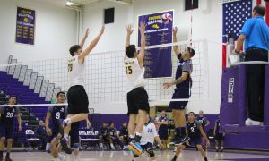 Moving up: (left to right) 19 Michael Campbell and 15 Mikey Esper helped the Kingsmen grab their second win of the season with the help of seven block between them. Photo by Adrian Francis--Staff Photographer