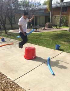 Tad Kasai competes in Quidditch obstacle course.