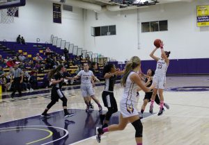 Draining shots: (L to R) (3) Makenna Murray, (32) Katy Lindor and (23) Sophia Cruz. The Regals powered past the Leopards with a 36-point victory Feb. 18. Cruz came away with four steals and eight points in the Regals win. Photo by Adrian Francis--Staff Photographer