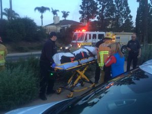 Unknown female Cal Lutheran student, driver of flipped Mazda CX-5, is transferred to an ambulance via stretcher in a neck brace. Photo by Molly Strawn, News Editor