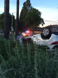 The white Mazda CX-5 flipped after colliding with a Kia Optima.  Photo by Dakota Allen, Staff Writer