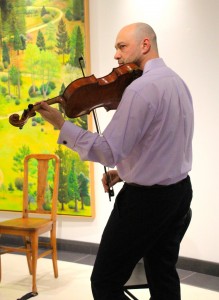 Perfectly in key: Alexander Gurevich, former member of the Florida Philharmonic, plays String Trio in B flat major, D 471 by Franz Schubert on the viola to open up the string trio concert in the William Rolland Gallery of Fine Art March 11.   