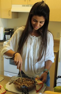 Monica Echeverri prepares her pear bread to serve to her roommates. Photo by Mary Crocker -  Staff Photographer 