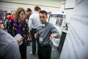 Cal Lutheran junior Gubidxa Gutierrez talks about his research project poster board. Photo provided by Brian Stetham.