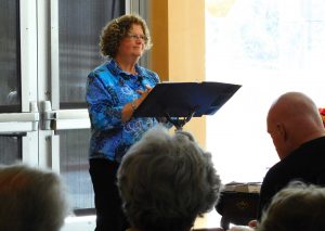 Interfaith activist Maryl Walters gives her speech on community in the current political climate.  Photo by Aliyah Navarro - Photojournalist 