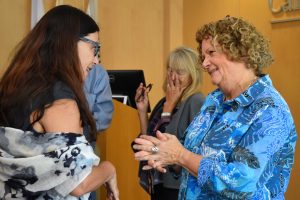 Maryl Walters speaking with a guest at the event hosted by Church of Christ, Scientist, Thousand Oaks at Cal Lutheran. Photo by Aliyah Navarro - Photojournalist