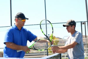 Head Coach Mike Gennette coaches both the men’s and women’s tennis teams at Cal Lutheran. Sebastian Ariza (right) hopes to improve upon his four wins in singles during his freshmen campaign. Photo by Inga Parkel- Photojournalist