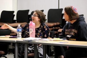 Finding paths to peace: Chelsea Darnell (left), beside Rabbi Belle Michael (right), responds to a question from presenters Sana Shah and Olivia Becker at the World Peace Open Mic Dinner.  Photo by Saoud Albuainain