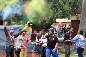 It’s a colorful life: Students take part in the second component of the Holi Festival known as Rangwali Holi, which involves throwing powdered colors. In the process, appearances fade and everyone becomes equal.  Photo by Saoud Albuanain- Photojournalist