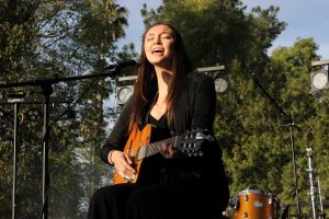 Paige Poggione, a first-year communication major, performs her original song “Thinking About You.” Photo by Rachel Holroyd