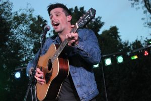 At Cal Lu Palooza on Friday night, Jeremiah Gray sings vocals and plays guitar for his original song, “My Dear.”  Photo by Rachel Holroyd- Photojournalist