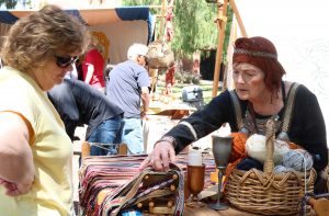 Look what I made: Judith Vinje shows Beth Camarillo materials and techniques from the Viking age. Photo by Inga Parkel- Photojournalist