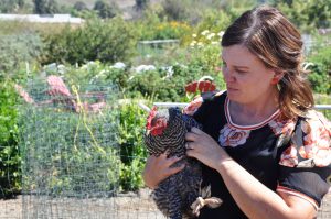 An ‘egg-cellent’ pair: Ritzau lives on an urban farm in Monrovia, California. She said she is in the process of integrating a new chicken in with the 12 chickens that already call the SEEd Garden home. Photo by Francisco Atkinson - Photojournalist