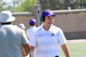 Kingsmen football Assistant Coach Diego Hernandez is the youngest on California Lutheran University’s football coaching staff. Off the field, Hernandez balances 17 credits of school and another job at a local movie theater. Photo provided by Jackie Rodriguez - Photojournalist