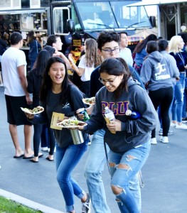 Students had a selection of food at the block party that included Mexican tacos or Asian-style rice bowls.  Photo by Christie Kurdys - Photojournalist