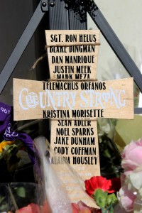 Country strong: A memorial site has been set up on the corner of Moorpark Road and Highway 101 South entrance to honor the 12 victims of the Nov. 7 shooting.  Photo by Arianna Macaluso - Photo Editor
