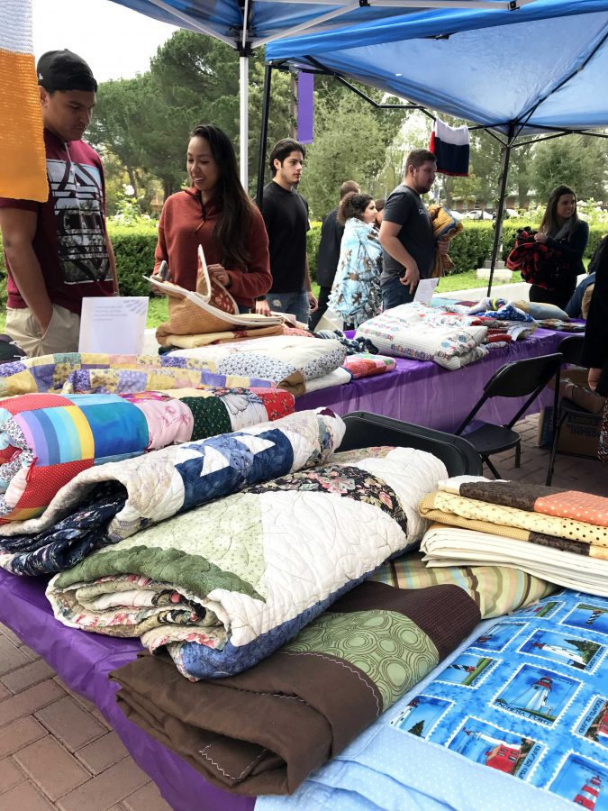 Quilted with care: Over 170 hand-made blankets, quilts and shawls were sent to Cal Lutheran from across the country to show support for the campus. They will be distributed again Dec. 4 and 5. 
Photo provided by Jordan Castro. 