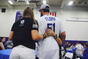 Pitcher Dylan Floro poses for a photo with junior Victoria Rose Meek and her mother Laura Lynn Meek after presenting them with a bat in honor of Justin Meek.  Photo by Arianna Macaluso - Photo Editor