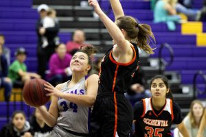 Junior forward Abi Torres-Drozd goes up against an Occidental defender in this file photo from the Regals’ Feb. 2 victory against Occidental College.  After the Feb. 2 win and a Feb. 9 loss to Pomona-Pitzer, the Regals sit at sixth in the SCIAC with a record of 6-8, tied with the University of Redlands’ 6-8 record.  (Photo by Gabby Flores - Photojournalist)