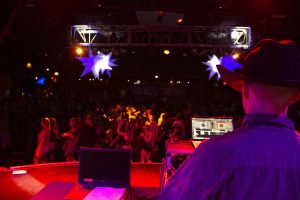 DJ Josh Kelly (right) mixes up the music for Borderline Country Night at the Canyon Agoura Hills. Photo by Gabby Flores- Photojournalist. 