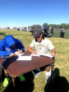 Senior Dominick Grimm signs his contract to play with the San Diego Strike Force arena football team after a tryout in December 2018. (Photo provided by Dominick Grimm)