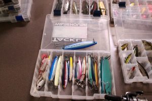 Ready for a new semester: Angel Abundez shows off part of his fishing gear collection, which will be used by the club he founded "Fishing Through Christ."  Photo by Joc Smith- Photojournalist. 