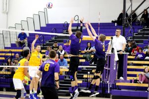 Senior opposite Brendan Ward and junior outside hitter Mason Mercer defend over the net against the Johnson & Wales University Bulldogs. After four wins in the Cal-Lu-Fornia Classic tournament, the Kingsmen are 9-7 on the season.  (Photo by Spencer Hardie - Photojournalist)