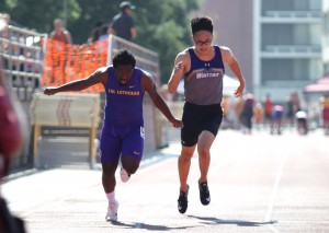 First-year sprinter Hasant Moses-Hillman comes across the finish line ahead of a Whitter College opponent during the 100 meter dash. Moses-Hillman finished with a time of 11.75 seconds on April 27, the first day of the 2-day SCIAC Track and Field Championship meet at Claremont-Mudd-Scripps. Photo by Brooke Stanley - Sports Editor))