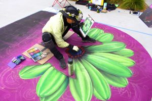 Mixing mediums: Full-time artist Sharyn Chan took multiple photos of various subjects and put them together to create her own piece out of chalk.  Photo by Jessica Colby - Photojournalist