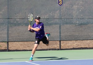 First-year Aaron Moylan hits a devastating ball back towards Whittier’s side. The Kingsmen outplayed the Poets 8-1 on Friday, April 12.  dxsPhoto by Spencer Hardie - Photojournalist)