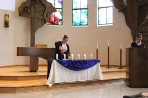 Come Together: Members of Hillel Club lit six candles during the service, each one representing one million Jews killed in WWII. Photo by Jessica Colby - Photojournalist