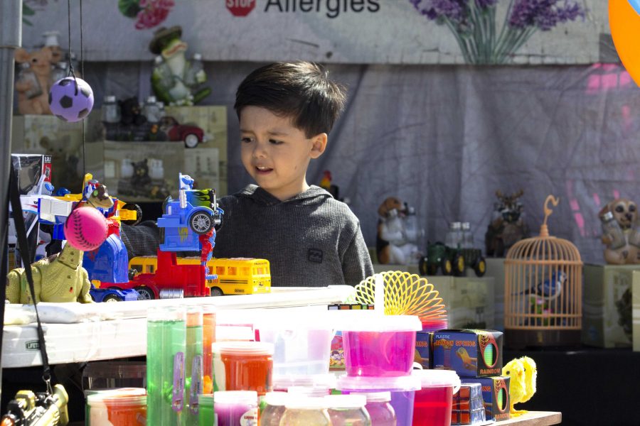 A fairly good time: In addition to crafts and games, children had the opportunity to play with toys of all sorts at entertainment booths throughout the quarter-mile stretch of fair grounds.
Photo by Gabby Flores - Photojournalist