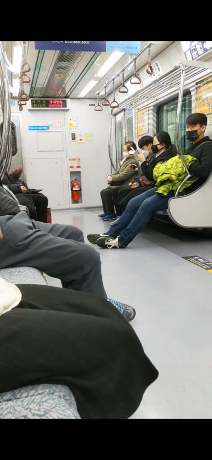 Workers commute on public transit in Daegu, South Korea during the global COVID-19 pandemic.