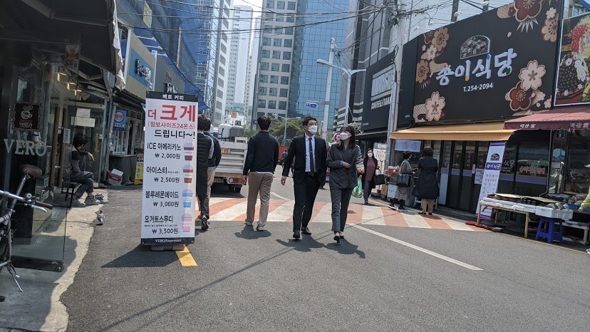 Business people go out for walks during breaks in Daegu, South Korea, a hotspot in the global COVID-19 pandemic.