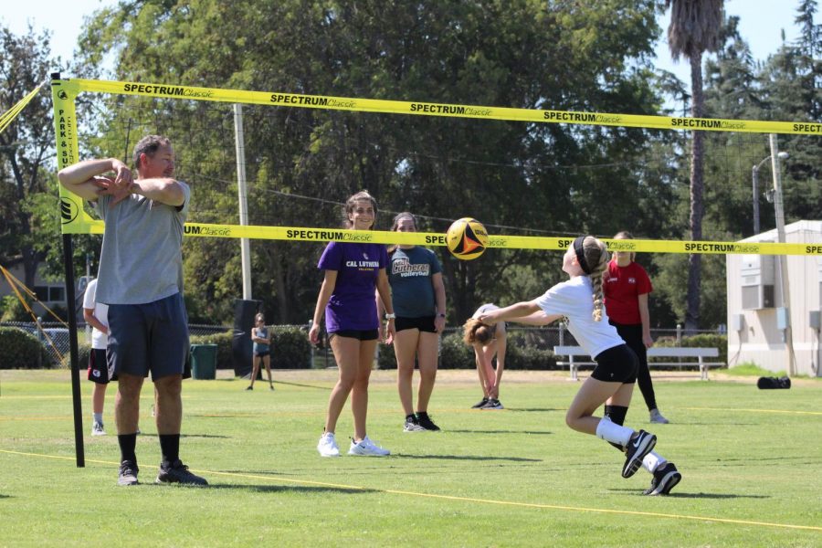 Regals Volleyball coaching kids to increase their skills and bring community.