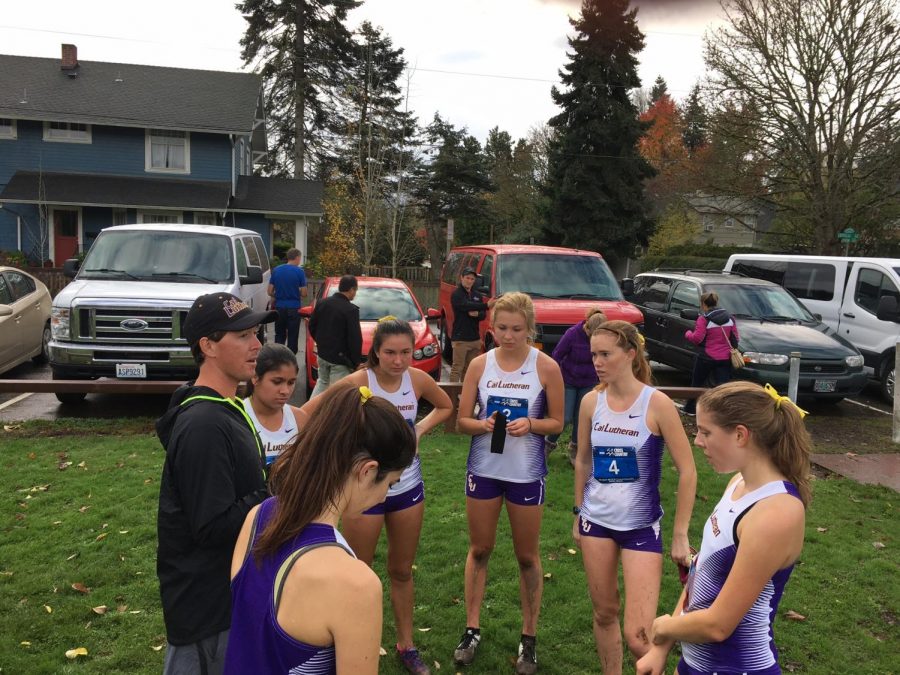 Cal Lutheran alumnus, Track and Field and Cross Country Assistant Coach Brett Halvaks talks to the Regals after a race.