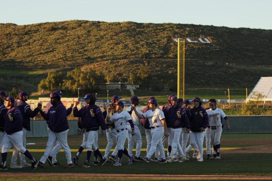 Kingsmen celebrate a victory on Opening Day.