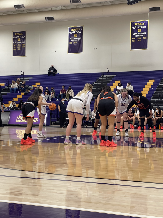 The Regals line up at the free throw line ready to rebound and push the ball up the court.