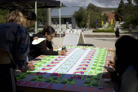 On Friday, April 22, Cal Lutheran students were completing their Street Tapestry on the spine. 